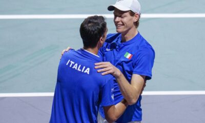 Italy's Jannik Sinner, right, celebrates with his teammate Lorenzo Sonego after winning against Serbia's Novak Djokovic and Miomir Kecmanovic during a Davis Cup semi-final doubles tennis match between Italy and Serbia in Malaga, Spain, Saturday, Nov. 25, 2023. (AP Photo/Manu Fernandez)