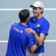 Italy's Jannik Sinner, right, celebrates with his teammate Lorenzo Sonego after winning against Serbia's Novak Djokovic and Miomir Kecmanovic during a Davis Cup semi-final doubles tennis match between Italy and Serbia in Malaga, Spain, Saturday, Nov. 25, 2023. (AP Photo/Manu Fernandez)