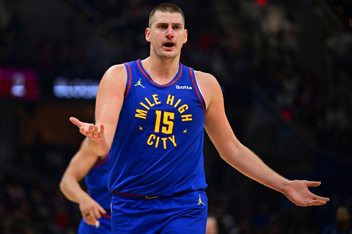 Denver Nuggets center Nikola Jokic disputes a non-call with an official in the first half of an NBA basketball game against the Cleveland Cavaliers, Sunday, Nov. 19, 2023, in Cleveland. (AP Photo/David Dermer)