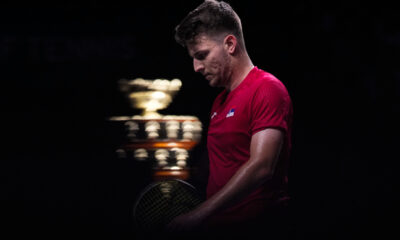 Serbia's Miomir Kecmanovic walks on the court, with the Davis Cup on the background, during a Davis Cup quarter-final tennis match between Serbia and United Kingdom in Malaga, Spain, Thursday, Nov. 23, 2023. (AP Photo/Manu Fernandez)