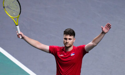Serbia's Miomir Kecmanovic walks on the court, with the Davis Cup on the background, during a Davis Cup quarter-final tennis match between Serbia and United Kingdom in Malaga, Spain, Thursday, Nov. 23, 2023. (AP Photo/Manu Fernandez)
