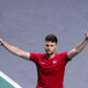 Serbia's Miomir Kecmanovic walks on the court, with the Davis Cup on the background, during a Davis Cup quarter-final tennis match between Serbia and United Kingdom in Malaga, Spain, Thursday, Nov. 23, 2023. (AP Photo/Manu Fernandez)