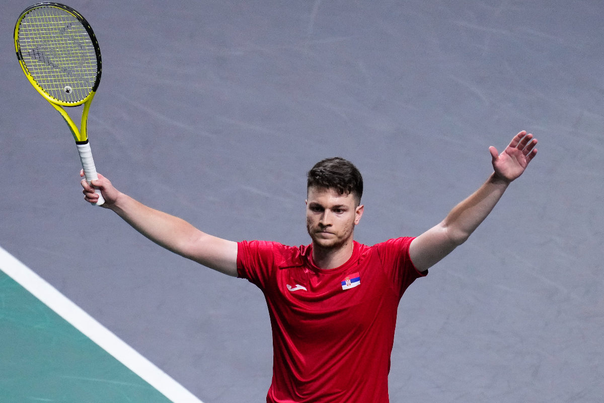 Serbia's Miomir Kecmanovic walks on the court, with the Davis Cup on the background, during a Davis Cup quarter-final tennis match between Serbia and United Kingdom in Malaga, Spain, Thursday, Nov. 23, 2023. (AP Photo/Manu Fernandez)