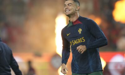 Portugal's Cristiano Ronaldo smiles as he warms up before the Euro 2024 group J qualifying soccer match between Portugal and Iceland, at the Alvalade Stadium in Lisbon, Sunday, Nov. 19, 2023. (AP Photo/Armando Franca)