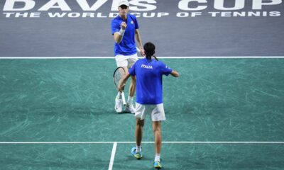 Italy's Janik Sinner, top, and Italy's Lorenzo Sonego celebrate after winning a point against Netherlands' Wesley Koolhof and Netherlands' Tallon Griekspoor during a Davis Cup quarter-final tennis match between Italy and Netherlands in Malaga, Spain, Thursday, Nov. 23, 2023. (AP Photo/Manu Fernandez)