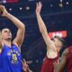 Denver Nuggets center Nikola Jokic, left, shoots against Cleveland Cavaliers forward Dean Wade, center, and forward Evan Mobley in the first half of an NBA basketball game, Sunday, Nov. 19, 2023, in Cleveland. (AP Photo/David Dermer)