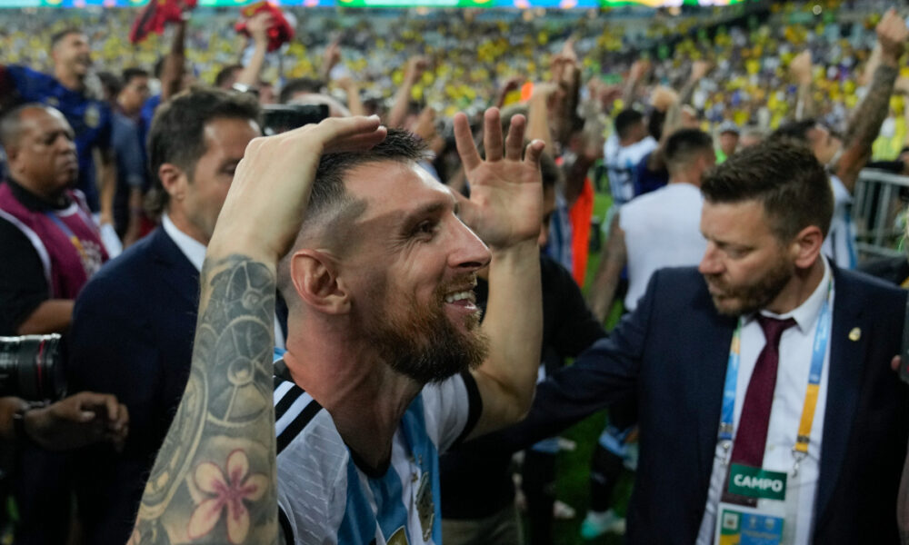 Argentina's Lionel Messi and teammates celebrate their team's 1-0 victory over Brazil at the end of a qualifying soccer match for the FIFA World Cup 2026 at Maracana stadium in Rio de Janeiro, Brazil, Tuesday, Nov. 21, 2023. (AP Photo/Silvia Izquierdo)