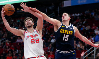 Houston Rockets center Alperen Sengun (28) pulls in a rebound next to Denver Nuggets center Nikola Jokic (15) during the second half of an NBA basketball In-Season Tournament game Friday, Nov. 24, 2023, in Houston. (AP Photo/Michael Wyke)