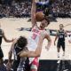 Houston Rockets center Alperen Sengun (28) scores over San Antonio Spurs forward Zach Collins (23) during overtime in an NBA basketball game in San Antonio, Friday, Oct. 27, 2023. (AP Photo/Eric Gay)