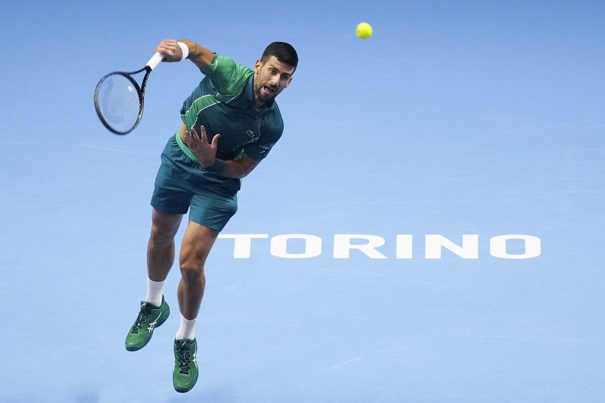 Serbia's Novak Djokovic serves to Spain's Carlos Alcaraz during their singles semifinal tennis match of the ATP World Tour Finals at the Pala Alpitour, in Turin, Italy, Saturday, Nov. 18, 2023. (AP Photo/Antonio Calanni)