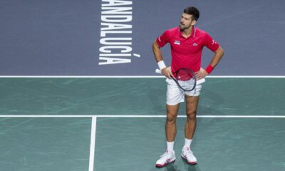 Serbia's Novak Djokovic reacts during his match with his teammate Miomir Kecmanovic against Italy's Jannik Sinner and Lorenzo Sonego during a Davis Cup semi-final doubles tennis match between Italy and Serbia in Malaga, Spain, Saturday, Nov. 25, 2023. (AP Photo/Manu Fernandez)