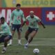 Brazil's Endrick, left, teammate Joelinton, right, battle for the ball during a training session ahead of a 2026 World Cup qualifier soccer match against Argentina, in Teresopolis, Brazil, Monday, Nov. 20, 2023. (AP Photo/Bruna Prado)