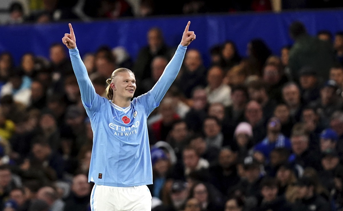Manchester City's Erling Haaland celebrates after scoring his side's opening goal during the English Premier League soccer match between Chelsea and Manchester City at Stamford Bridge stadium in London, Sunday, Nov. 12, 2023. (John Walton/PA via AP)