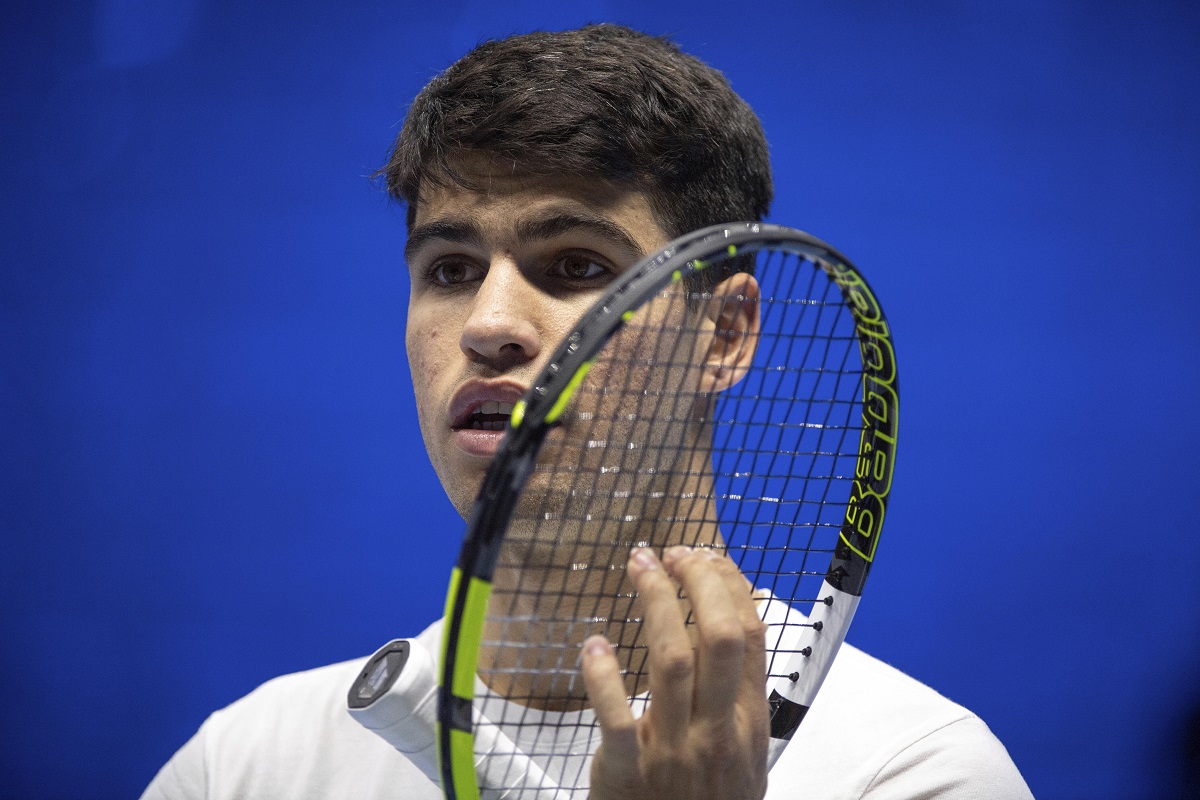 Spain's Carlos Alcaraz reacts as he plays Serbia's Novak Djokovic during a training session ahead of the ATP Finals, in Turin, Italy, Friday, Nov. 10, 2023. (Marco Alpozzi/LaPresse via AP)