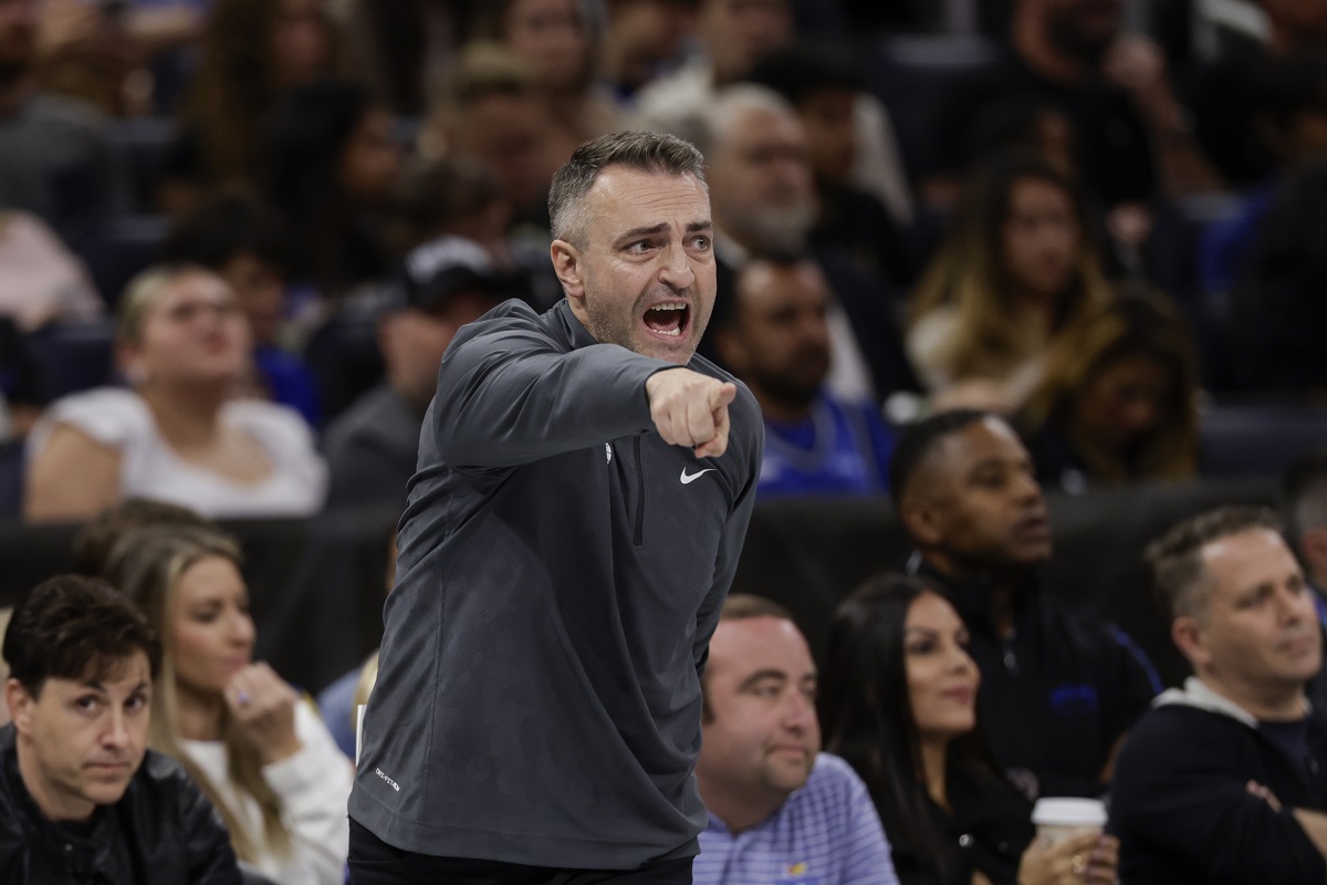 Toronto Raptors coach Darko Rajakovic yell instructions during the first half of the team's NBA basketball In-Season Tournament game against the Orlando Magic, Tuesday, Nov. 21, 2023, in Orlando, Fla. (AP Photo/Kevin Kolczynski)