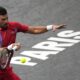 Serbia's Novak Djokovic returns the ball to Argentina's Tomas Martin Etcheverry during the second round of the Paris Masters tennis tournament, at the Accor Arena, Wednesday Nov.1, 2023 in Paris. (AP Photo/Michel Euler)