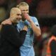 Manchester City's head coach Pep Guardiola talks to Manchester City's Erling Haaland after the English Premier League soccer match between Manchester United and Manchester City at Old Trafford stadium in Manchester, England, Sunday, Oct. 29, 2023. (AP Photo/Dave Thompson)