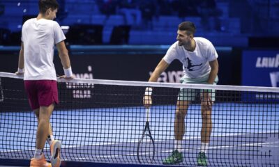 Spain's Carlos Alcaraz, left, and Serbia's Novak Djokovic during a training session ahead of the ATP Finals, in Turin, Italy, Friday, Nov. 10, 2023. (Marco Alpozzi/LaPresse via AP)