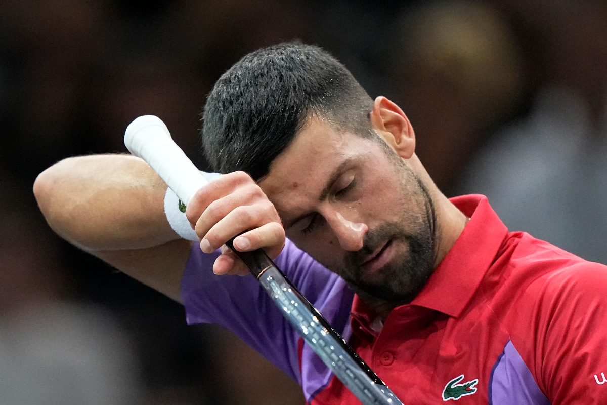 Serbia's Novak Djokovic wipes his forehead as he plays Argentina's Tomas Martin Etcheverry during the second round of the Paris Masters tennis tournament, at the Accor Arena, Wednesday Nov.1, 2023 in Paris. (AP Photo/Michel Euler)
