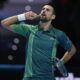Serbia's Novak Djokovic reacts during his singles semifinal tennis match against Spain's Carlos Alcaraz of the ATP World Tour Finals at the Pala Alpitour, in Turin, Italy, Saturday, Nov. 18, 2023. (AP Photo/Antonio Calanni)
