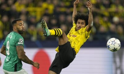 Dortmund's Karim Adeyemi, right, fights for the ball by Newcastle's Callum Wilson during the Champions League Group F soccer match between Borussia Dortmund and Newcastle United in Dortmund, Germany, Tuesday, Nov. 7, 2023. (AP Photo/Martin Meissner)