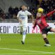 AC Milan's Luka Jovic, right, scores the opening goal during the Serie A soccer match between AC Milan and Frosinone at the San Siro stadium, in Milan, Italy, Friday, Dec. 2, 2023. (AP Photo/Luca Bruno)
