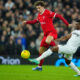 West Ham's Mohammed Kudus, right, and Liverpool's Curtis Jones battle for the ball during the English League Cup quarterfinal soccer match between Liverpool and West Ham United at the Anfield stadium in Liverpool, England, Wednesday, Dec. 20, 2023. (AP Photo/Jon Super)