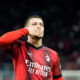 AC Milan's Luka Jovic celebrates after scoring the opening goal during the Serie A soccer match between AC Milan and Frosinone at the San Siro stadium, in Milan, Italy, Friday, Dec. 2, 2023. (AP Photo/Luca Bruno)