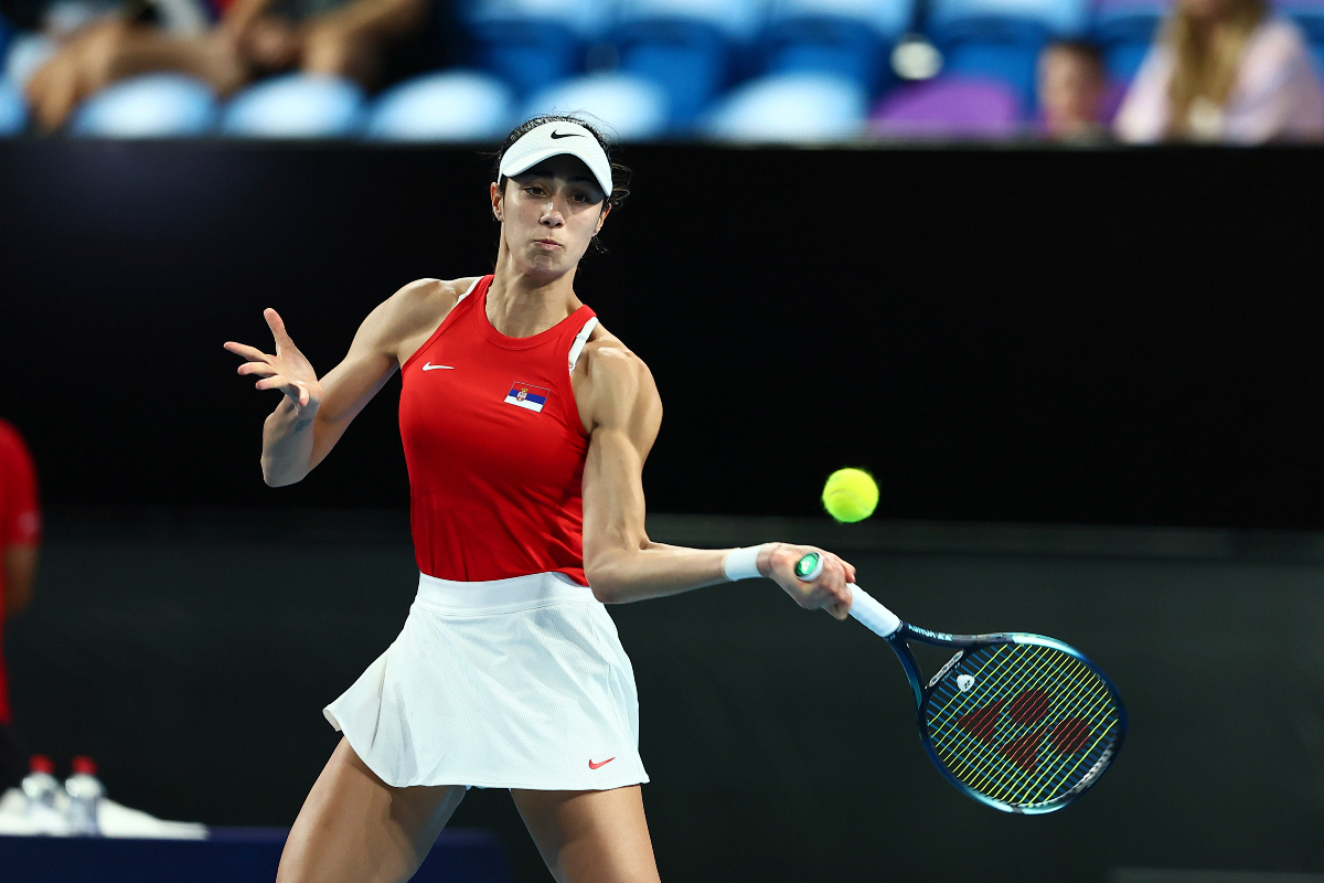 Olga Danilovic of Serbia plays a return shot to Qinwen Zheng of China during the United Cup tennis tournament in Perth, Australia, Sunday, Dec. 31, 2023. (AP Photo/Trevor Collens)