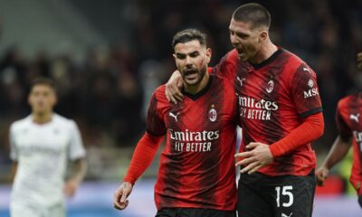 AC Milan's Theo Hernandez, left, celebrates with teammate Luka Jović after scoring his side's opening goal during a Serie A soccer match between AC Milan and Fiorentina, in Milan's San Siro Stadium, Italy, Saturday, Nov. 25, 2023. (Spada/LaPresse via AP)