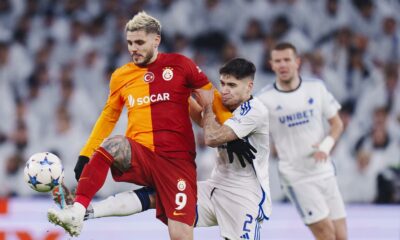 Copenhagen's Kevin Diks, center right, and Galatasaray's Mauro Icardi fight for the ball during the Champions League Group A soccer match between FC Copenhagen and Galatasaray, at the Parken Stadium, in Copenhagen, Tuesday, Dec. 12, 2023. (Liselotte Sabroe/Ritzau Scanpix via AP)