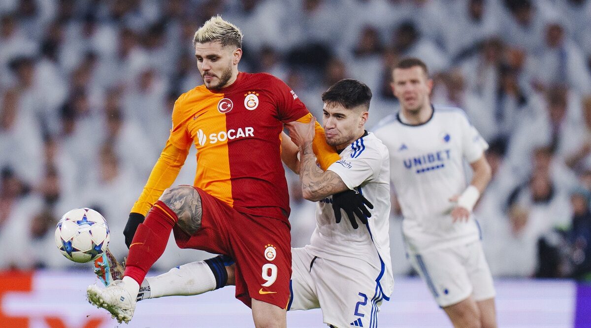 Copenhagen's Kevin Diks, center right, and Galatasaray's Mauro Icardi fight for the ball during the Champions League Group A soccer match between FC Copenhagen and Galatasaray, at the Parken Stadium, in Copenhagen, Tuesday, Dec. 12, 2023. (Liselotte Sabroe/Ritzau Scanpix via AP)