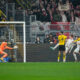 Mainz's Sepp van den Berg, fourth right, scores his sides first goal during the German Bundesliga soccer match between Borussia Dortmund and 1. FSV Mainz 05 at the Signal-Iduna Park in Dortmund, Germany, Tuesday, Dec. 19, 2023. (AP Photo/Martin Meissner)