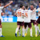 Manchester City's Mateo Kovacic celebrates with teammate Kyle Walker, 2nd right, after scoring his side's second goal during the Soccer Club World Cup semifinal soccer match between Urawa Reds and Manchester City FC at King Abdullah Sports City Stadium in Jeddah, Saudi Arabia, Tuesday, Dec. 19, 2023. (AP Photo/Manu Fernandez)