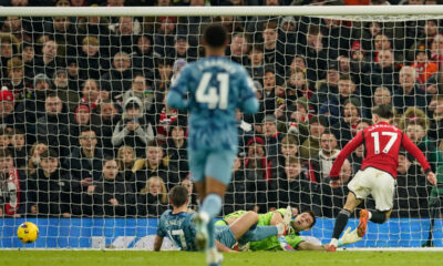 Manchester United's Alejandro Garnacho, right, scores his side's opening goal during the English Premier League soccer match between Manchester United and Aston Villa at the Old Trafford stadium in Manchester, England, Tuesday, Dec. 26, 2023. (AP Photo/Dave Thompson)