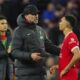 Liverpool's manager Jurgen Klopp, left, speaks with his player Trent Alexander-Arnold at the end of the English Premier League soccer match between Liverpool and Arsenal at Anfield stadium in Liverpool, England, Saturday, Dec. 23, 2023. (AP Photo/Jon Super)
