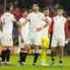 Sevilla players stand after the the Champions League Group B soccer match between Sevilla and PSV at the Ramon Sanchez-Pizjuan stadium in Seville, Spain, Wednesday, Nov.29, 2023. (AP Photo/Jose Breton)