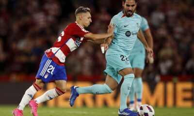 FILE - Granada's Bryan Zaragoza pushes Barcelona's Ilkay Gundogan during a Spanish La Liga soccer match between Granada and Barcelona at Los Carmanes Stadium in Granada, Spain, on Oct. 8, 2023. Bayern Munich is signing Spain winger Bryan Zaragoza from struggling La Liga team Granada, with the deal set to go through in July. The German champion said Wednesday Dec. 6, 2023 that the 22-year-old Zaragoza would sign a five-year contract running through to 2029 when he joins Bayern at the end of the season. (AP Photo/Fermin Rodriguez, File)