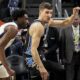 Atlanta Hawks guard Bogdan Bogdanovic (13) and Memphis Grizzlies guard Vince Williams Jr. (5) vie for a loose ball during the first half of an NBA basketball game, Saturday, Dec. 23, 2023, in Atlanta. (AP Photo/Mike Stewart)