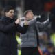 Arsenal's manager Mikel Arteta, left, and Luton Town's head coach Rob Edwards react during the English Premier League soccer match between Luton and Arsenal at Kenilworth Road, Luton, England, Tuesday, Dec. 5, 2023. (AP Photo/Ian Walton)