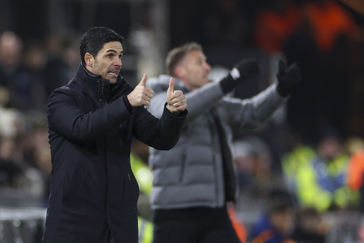 Arsenal's manager Mikel Arteta, left, and Luton Town's head coach Rob Edwards react during the English Premier League soccer match between Luton and Arsenal at Kenilworth Road, Luton, England, Tuesday, Dec. 5, 2023. (AP Photo/Ian Walton)
