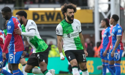 Liverpool's Mohamed Salah, centre, celebrates after scoring his side's opening goal during the Premier League soccer match between Crystal Palace and Liverpool at Selhurst Park, in London, England, Saturday, Dec. 9, 2023. (AP Photo/Kin Cheung)