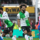 Liverpool's Mohamed Salah, centre, celebrates after scoring his side's opening goal during the Premier League soccer match between Crystal Palace and Liverpool at Selhurst Park, in London, England, Saturday, Dec. 9, 2023. (AP Photo/Kin Cheung)