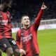AC Milan's Luka Jovic, right, celebrates after scoring the opening goal during the Serie A soccer match between AC Milan and Frosinone at the San Siro stadium, in Milan, Italy, Friday, Dec. 2, 2023. (AP Photo/Luca Bruno)