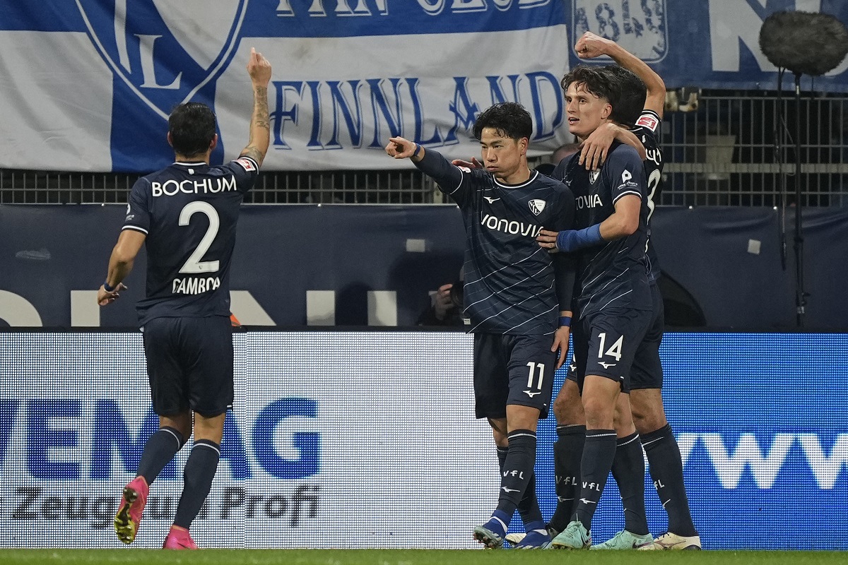 Bochum's Takuma Asano, center, celebrates after he scored the opening goal during the German Bundesliga soccer match between VfL Bochum and Union Berlin in Bochum, Germany, Saturday, Dec. 16, 2023. (AP Photo/Martin Meissner)