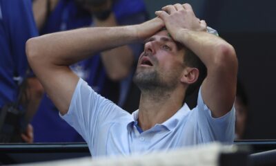 Novak Djokovic of Serbia places a bag of ice on his head during a break in his quarterfinal against Taylor Fritz of the U.S. at the Australian Open tennis championships at Melbourne Park, Melbourne, Australia, Tuesday, Jan. 23, 2024. (AP Photo/Asanka Brendon Ratnayake)