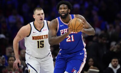 Philadelphia 76ers' Joel Embiid, right, tries to keep away from Denver Nuggets' Nikola Jokic during the first half of an NBA basketball game, Tuesday, Jan. 16, 2024, in Philadelphia. (AP Photo/Matt Slocum)