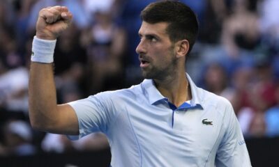 Novak Djokovic of Serbia reacts during his quarterfinal against Taylor Fritz of the U.S. at the Australian Open tennis championships at Melbourne Park, Melbourne, Australia, Tuesday, Jan. 23, 2024. (AP Photo/Andy Wong)