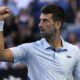 Novak Djokovic of Serbia reacts during his quarterfinal against Taylor Fritz of the U.S. at the Australian Open tennis championships at Melbourne Park, Melbourne, Australia, Tuesday, Jan. 23, 2024. (AP Photo/Andy Wong)