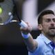 Novak Djokovic of Serbia plays a forehand return to Taylor Fritz of the U.S. during their quarterfinal match at the Australian Open tennis championships at Melbourne Park, Melbourne, Australia, Tuesday, Jan. 23, 2024. (AP Photo/Andy Wong)